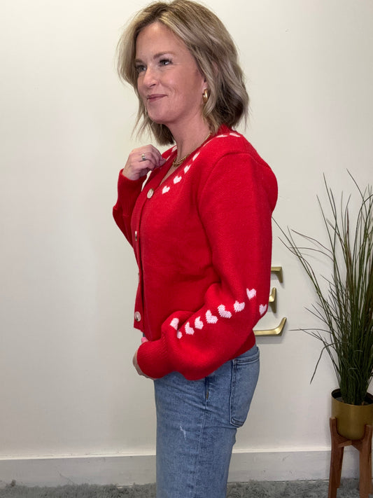 cute button front red cardigan sweater with pink embroidered hearts on trim Valentine’s Day so me date night