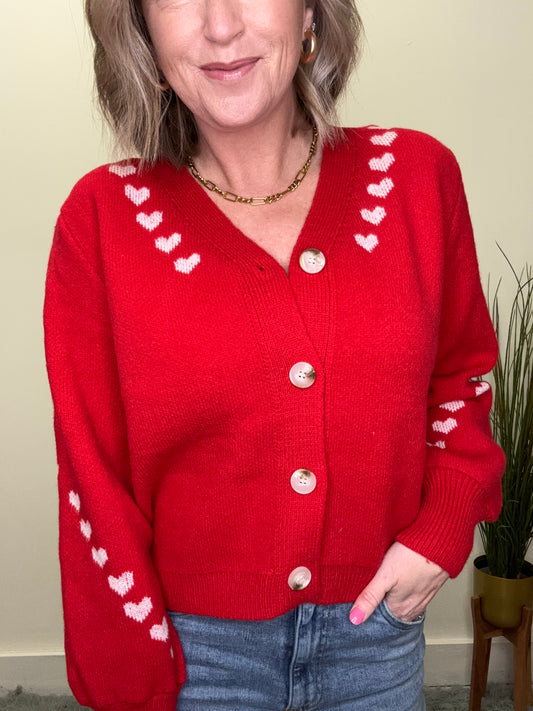 cute button front red cardigan sweater with pink embroidered hearts on trim Valentine’s Day so me date night