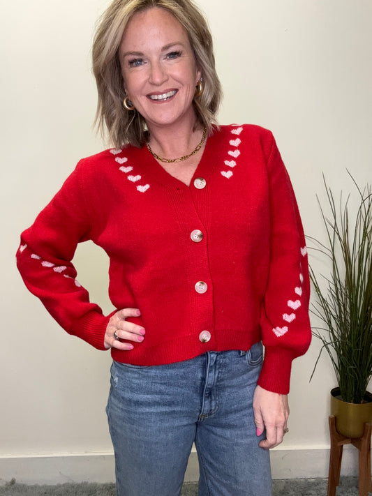 cute button front red cardigan sweater with pink embroidered hearts on trim Valentine’s Day so me date night